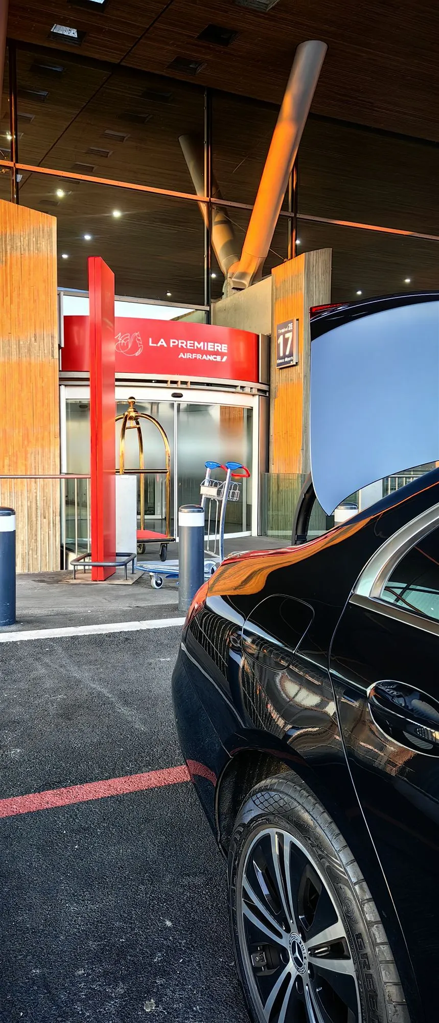 Chauffeur at the Air France La Première entrance, Terminal 2E — watch the video on YouTube