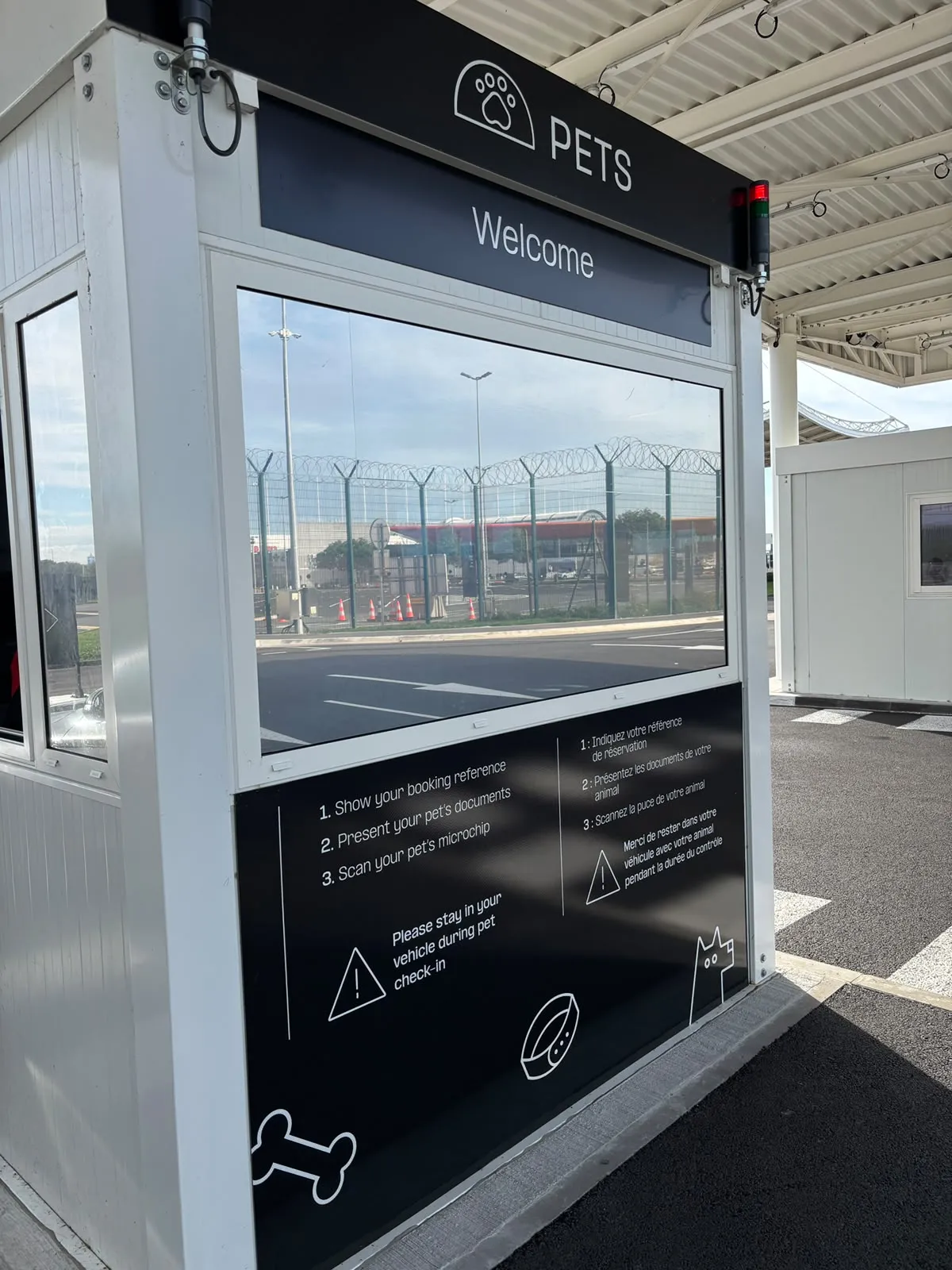 Eurotunnel Pet Reception desk at Coquelles: booking reference, pet documents, chip scan, stay in your vehicle