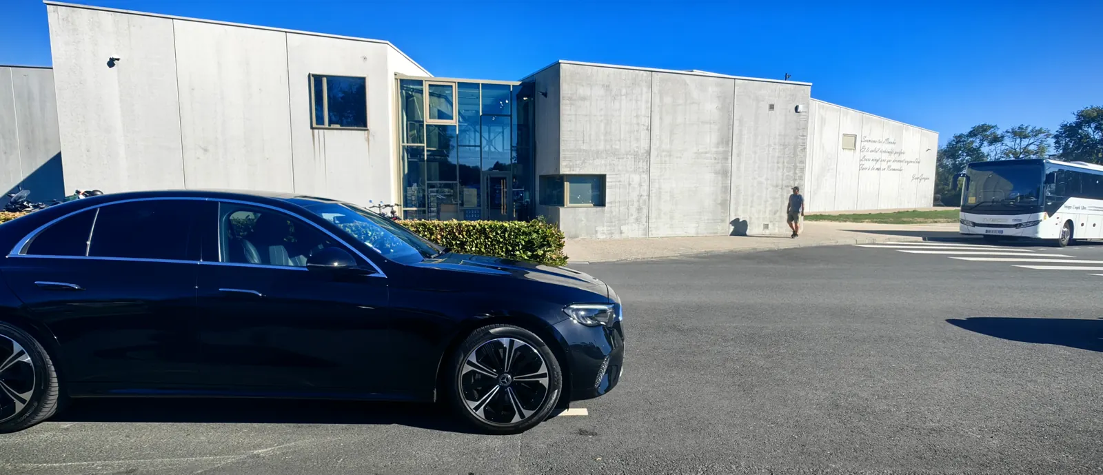 Our chauffeur-driven Mercedes E-Class outside the Overlord Museum at Colleville-sur-Mer, on a private Normandy day trip from Paris